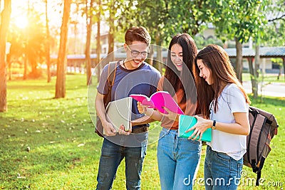 Three Asian young campus people tutoring and preparing for final Stock Photo