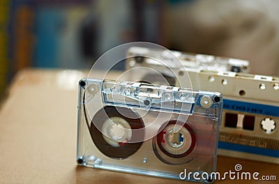 Three audio cassettes standing on the table Stock Photo