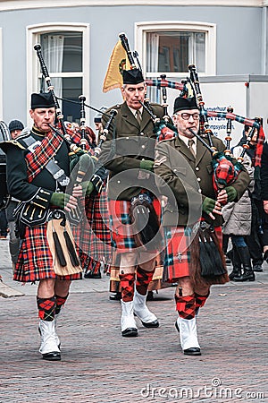 Three bagpipe players during the Dickens Festival in Deventer Editorial Stock Photo