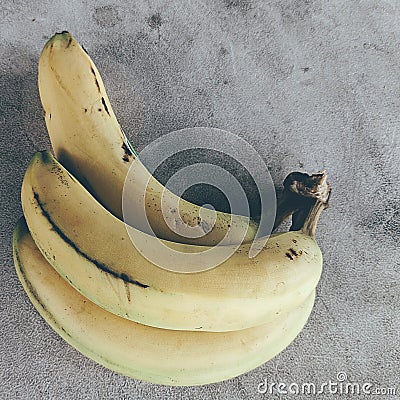 three banana buds on a table Stock Photo