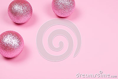 Three baubles on pink Stock Photo