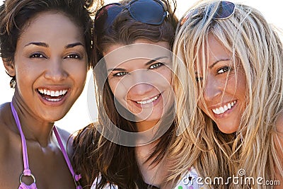 Three Beautiful Young Women Friends Laughing Stock Photo