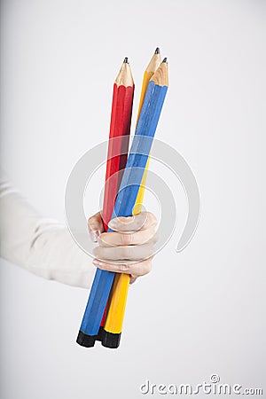 Three big pencils in hand Stock Photo