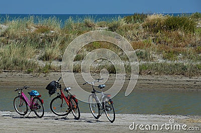 Three bikes on a beach Stock Photo