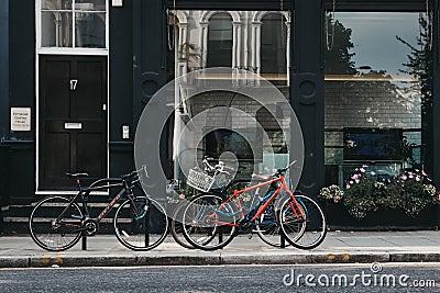 Three bikes parked on the street in London, UK. Editorial Stock Photo