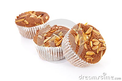 Three biscuit cupcakes with nuts Stock Photo