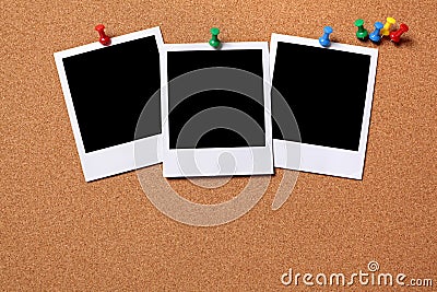 Three blank polaroid frame photo print pushpin cork background Stock Photo