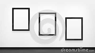 Three blank posters with black frames on the white wall. Picture gallery mockup Stock Photo