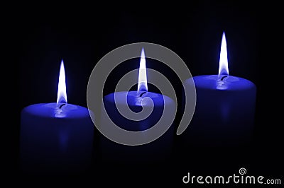 Three blue candles Stock Photo