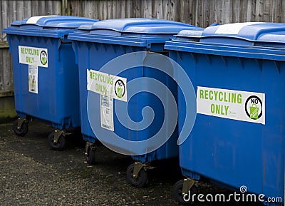Three blue recycling wheelie bins Stock Photo