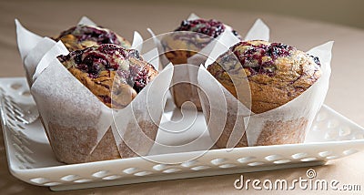 Three Blueberry Muffins On Cake Plate. Stock Photo