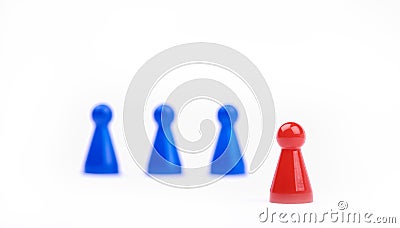 Three blurred blue game pieces as a team and one red sharpened figure as a leader in the foreground. Closeup photo with selective Stock Photo