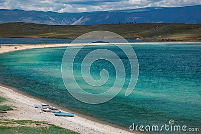 Three boats on the beach of Baikal lake Editorial Stock Photo