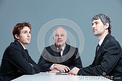 Three bored businessmen in a meeting Stock Photo