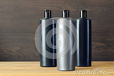 Three bottles of shampoo or shower gel without a label. Stock Photo