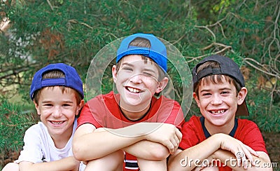 Three Boys in Baseball Hats Stock Photo