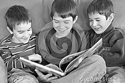 Three Boys Reading Stock Photo