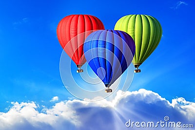 Three bright hot air balloons on the sky, symbol of the RGB color scheme Stock Photo