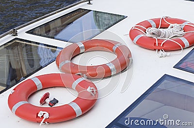 Three bright orange lifebuoys Stock Photo