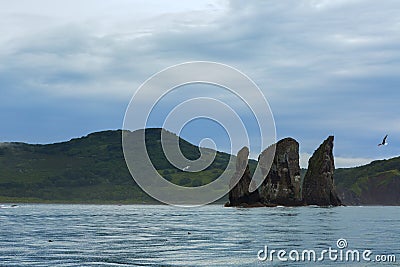 Three Brothers Rocks in the Avacha Bay of Pacific Ocean. Coast of Kamchatka. Stock Photo