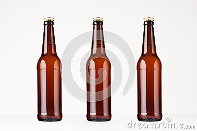 Three brown longneck beer bottles mock up. Stock Photo