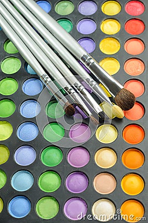 Three Brushes on the palette of eye shadow Stock Photo