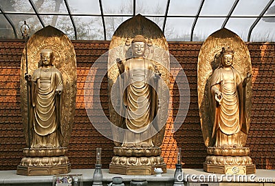 Three Buddhas on Dais Stock Photo
