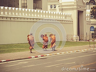 Three Buddhist monks in front of royal palace Bangkok Editorial Stock Photo