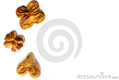 Three buns of different shapes on a white background. Culinary composition. Homemade baking. Stock Photo
