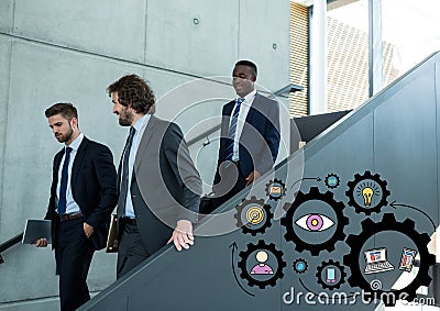 Three business men walking down stairs and black gear graphics Stock Photo