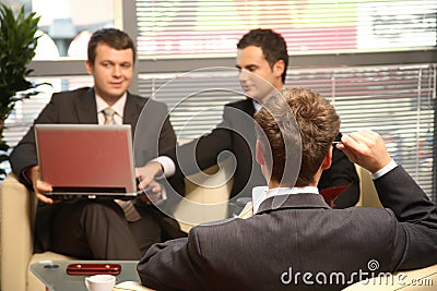 Three Business men working in the office Stock Photo