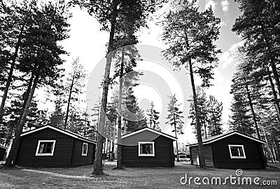 Three cabins in woods Stock Photo