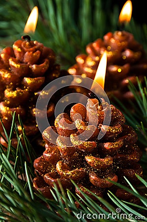 Three candles like pine cones Stock Photo