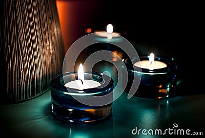 Three candles in the night. Stock Photo