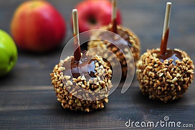 Three caramel apples with peanuts Stock Photo