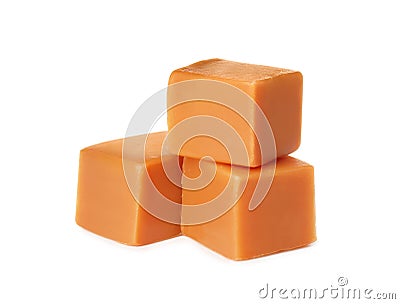 Three caramel cubes on white background. Confectionery Stock Photo