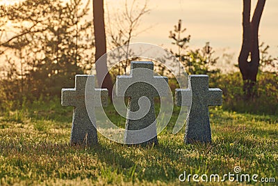 Stone crosses at sunset in German military cemetery, Europe Stock Photo