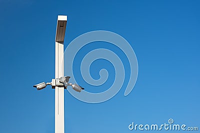 Three CCTV cameras on a lamppost Stock Photo