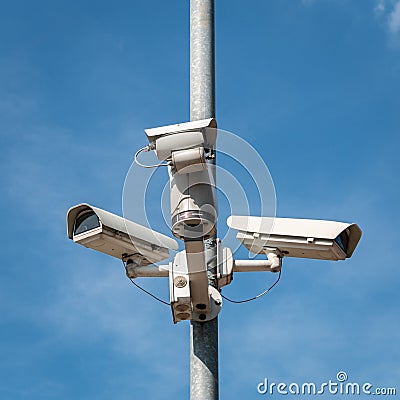 Three CCTV cameras on a pole. Stock Photo