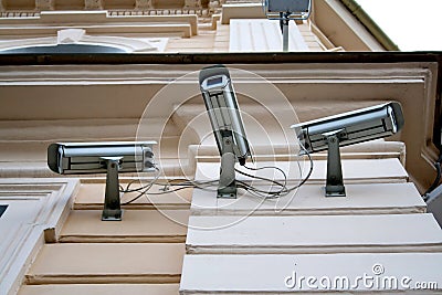 Three cctv security cameras Stock Photo