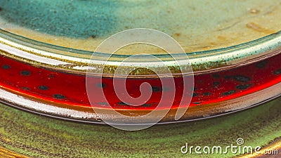 Three ceramic plates of different colors. Part of the frame Stock Photo