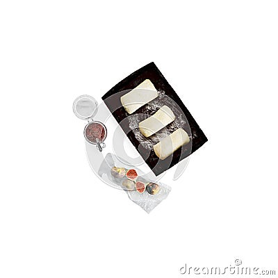 three cheeses in separate packs on a white surface next to some drinks Stock Photo