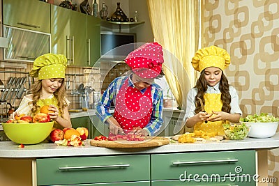 Three children in the kitchen. Stock Photo