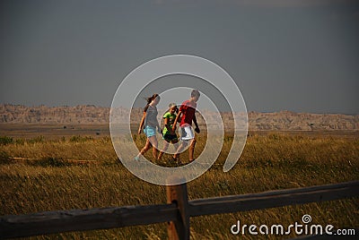 Three Children Walking in the Badlands National Park Stock Photo