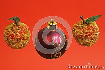 Three Christmas decorations (two apples and a purple bauble) Stock Photo