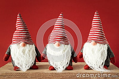 three Christmas gnomes with white beards Stock Photo