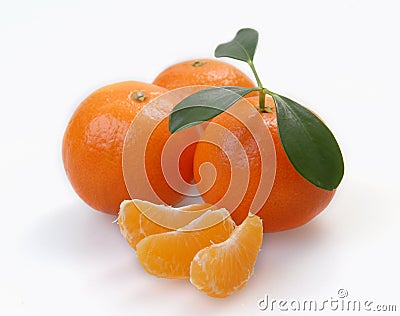 Three clementines with segments Stock Photo