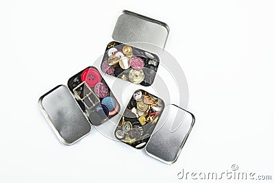 Three clothing buttons metal boxes collection Stock Photo