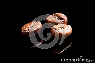 Three coffee beans. Stock Photo
