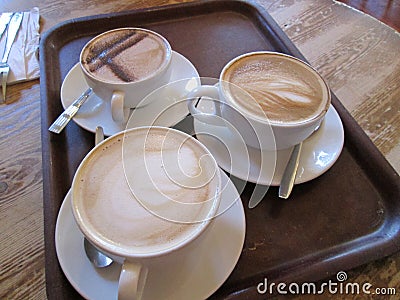 Three Coffee beverages on a tray Stock Photo